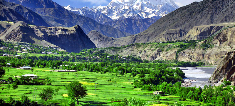 A beautiful scenery of Chitral valley with snow-capped mountains